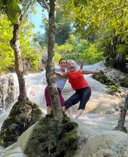 Wild women enjoying waterfall