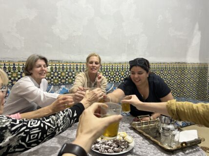Women enjoying welcome dinner and the culture in Morocco