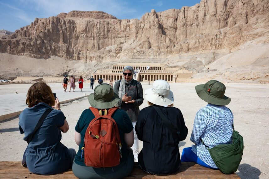 Wild Women Expeditions group listening to guide at ancient Egyptian site