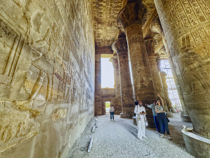 Wild Women Expeditions group listening to guide at ancient Egyptian site