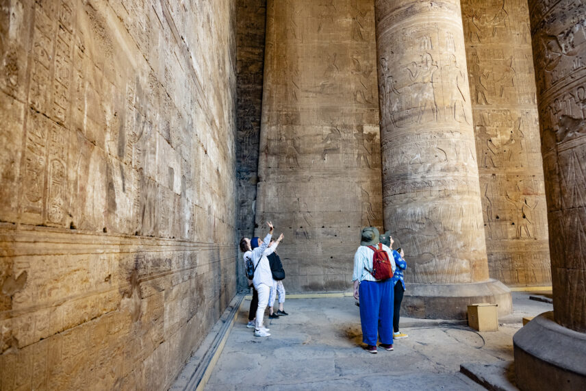 Wild Women Expeditions group listening to guide at ancient Egyptian site