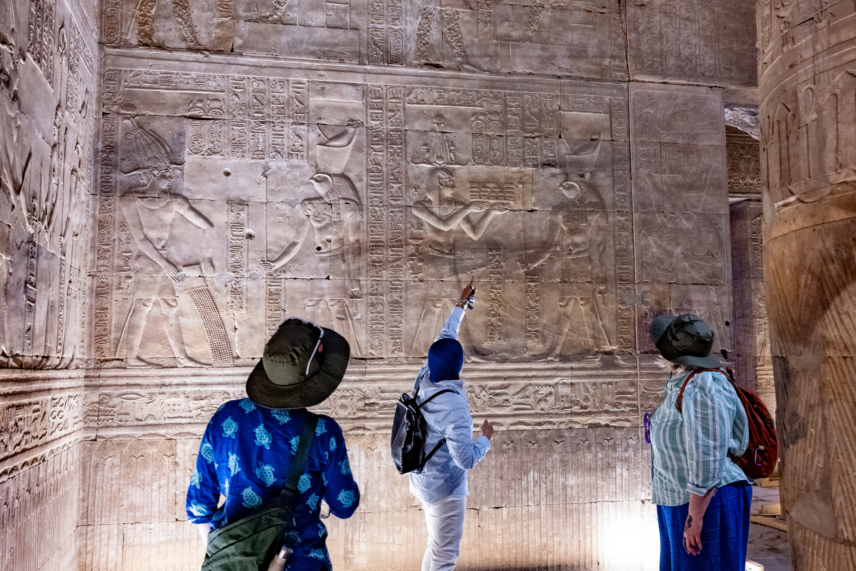 Wild Women Expeditions group listening to guide at ancient Egyptian site