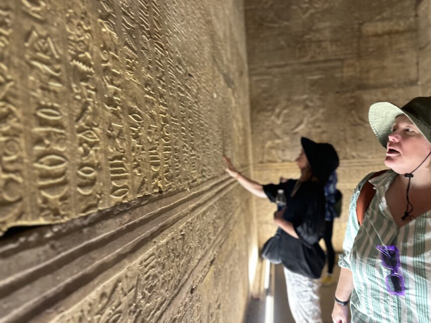 Wild Women Expeditions group listening to guide at ancient Egyptian site